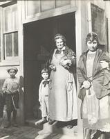 [Syrian American family in front of their residence at 10th and Ellsworth Streets, Philadelphia.] [graphic].