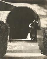 [Unidentified woman standing in arched doorway] [graphic].