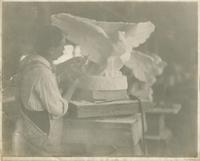 [Marble carver in workshop sculpting an eagle for entresol floor of the Pennsylvania capitol building.] [graphic].