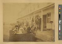 [Group portrait including photographer W.L. Germon on the porch of the hotel Long Beach House] [graphic] / Photo by Germon.