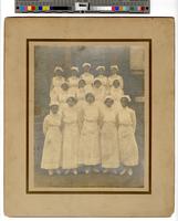 [Group portrait photograph of fourteen African American nurses and nursing students outside of Dr. J. H. Mudgett’s Private Hospital and Training School for Nurses, 2030 N. 13th Street, Philadelphia] [graphic] / Dan E. Paul, commercial photography, Bell Ph