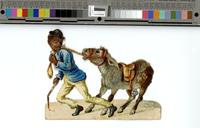 [African American man pulling a donkey on a rope] [graphic].