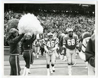 [Philadelphia Eagles football players Edward Herman, Dennis Harrison, and Woody Peoples entering the field at Veterans Stadium, Philadelphia]