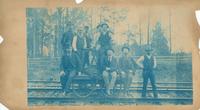 Group on the Hand Cart Taken at Stony Run, Section #10 Whitaker Station, Foreman P.G. McNamee [including] 1. Geo. W. Andrews, F of B & B 2. Dr. Robb, Medical Examiner 3. Wm. A. Pratt, Div Engr M of W 4. P.G. McNamee, Foreman.