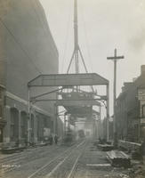 Progress of steel construction in Front St. at bent #57 looking south, May 16, 1916.