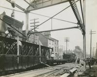 Progress of steel construction in Front St. at bent #85, looking north showing crosswires, June 12, 1916.