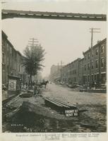 Progress of steel construction in Front St. at bent 99, looking north, showing crosswires, June 19, 1916.