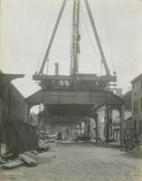 Progress of steel construction in Front St. at bent 108, looking south, July 3, 1916.