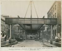 Progress of steel work, looking south on Front St. from bent 114, July 24, 1916.