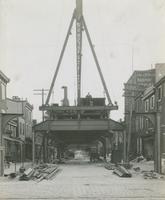 Progress of steel construction, looking south on Front St. from bent 137, August 7, 1916.