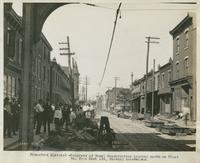 Progress of steel construction, looking north on Front St. from bent 155, showing crosswires, August 14, 1916.