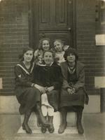 Five girls sitting on marble steps, Philadelphia.