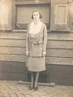 Young woman standing in front of window, Philadelphia.