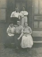Three women and two men on a wooden stoop, Philadelphia.