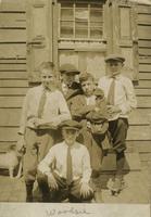 Five boys posing in front of wooden house, Philadelphia.