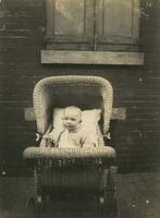 Infant in wicker baby carriage, Philadelphia.