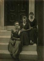 Three women sitting on marble steps, Philadelphia.