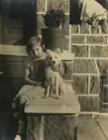 Girl and her dog on a stone porch, Philadelphia.