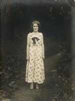 Young woman standing on woodland path, Philadelphia.