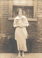 Woman standing in front of window, Philadelphia.