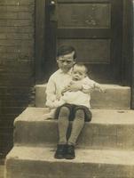 Boy with baby on old marble steps, Philadelphia.