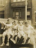 Children sitting on the hood of a car or truck, Philadelphia.