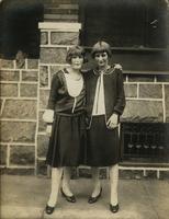 Two women standing in front of stone porch, Philadelphia.