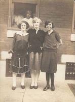 Three young women standing in front of window, Philadelphia.