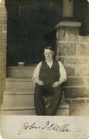 John Frank Keith sitting on porch steps, Philadelphia.