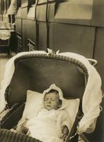 Infant in baby carriage with netting, Philadelphia.