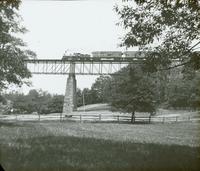 [Train crossing an unidentified trestle bridge.]