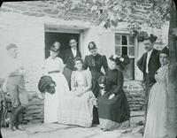 [Group portrait in front of a stone mill building, Fairmount Park.]