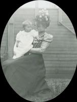 [Woman holding a baby.]