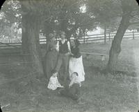 [Group portrait with Catharine Rupp Doering standing under tall trees, Sellersville, Pennsylvania.]