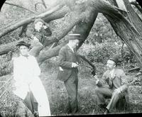 [Group portrait with Catharine Rupp Doering and Charles Rupp in a wooded area.]