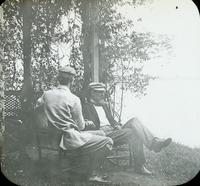 [Two friends of William Doering sitting on the bank of the Delaware River, Beverly, N.J.]