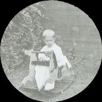 [Karl Doering as a young child, sitting in the backyard of the family residence, 1837 N. Bouvier Street, Philadelphia.]