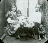 [Children sitting in the backyard of the Doering residence, 1837 N. Bouvier Street, Philadelphia.]