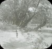 [Albert Lindsay Doering standing along pathway next to the Schuylkill River Canal, below the Columbia Bridge, Philadelphia.]