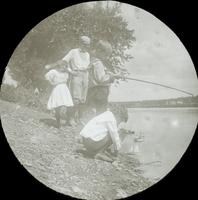 [Group fishing and sailing toy boats along the Schuylkill River, Philadelphia.]