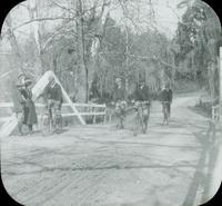 [Group bicycling over a canal bridge, Fairmount Park, Philadelphia.]