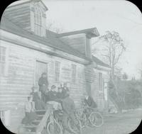 [Outing in the country, group sitting on stairway of unidentified building.]