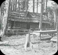 [Log cabin in the woods.]