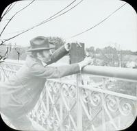 [William Harvey Doering taking a photograph from the Strawberry Mansion Bridge, Philadelphia.]