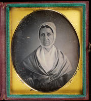 [Portrait of an unsmiling, unidentified woman with white cotton cap.]
