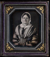 [Portrait of an unidentified, bespectacled woman.]