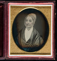 [Portrait of an unidentified, older woman, wearing a white cap, looking slightly to her right.]