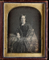 [Portrait of an unidentified woman wearing an ornate shawl over her dress.]
