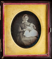 [Julianna Randolph Wood holding her baby daughter, Julia, on her lap.]