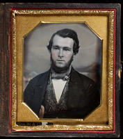 [Portrait of a serious looking, bearded young man.]